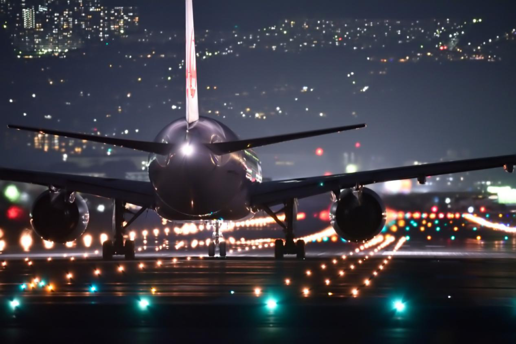 A close-up of a plane in the dark night.