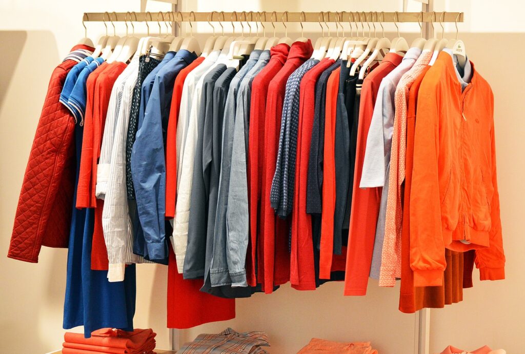Comfortable clothes hanging in a closet